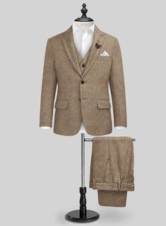 Our Irish Brown Herringbone Tweed Boys Suit is the ultimate blend of class and comfort, excelling on all levels of luxury. Crafted from the coziest wool, our suit boasts a fresh brown shade in a herringbone design, elevating your little man's style game without compromising comfort. Whether it's a family wedding, a fancy dinner, or just a day when he wants to feel extra special, this suit is his ticket to looking sharp - because every kid deserves to feel like a fashion icon.   Look Includes  Ir Italian Suit, Brown Shade, Herringbone Design, Linen Suits, Herringbone Tweed, Tweed Suits, Fancy Dinner, Tweed Fabric