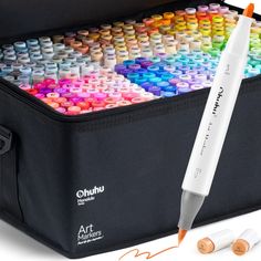 an open case with some pens and markers in it