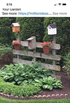 a wooden fence that has some plants growing on it and two birdhouses in the back