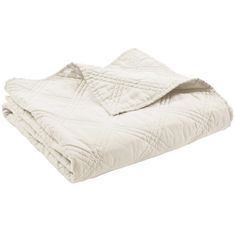 the white quilted blanket is folded up