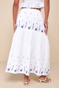 With your favorite sandals and the Lulus Summery Aura White Embroidered Tiered High-Waisted Maxi Skirt, your warm weather looks will always be adorable! Lightweight woven fabric shapes this breezy skirt that has a high, elasticized waist and a tiered design, with blue floral embroidered details throughout. Maxi hem completes the look. Pair with the matching top for a complete look! Fit: This garment fits true to size. Length: Ankle length. Size medium measures 36.5" from waist to hem. Waist: Fit Spring Embroidered Ankle-length Bottoms, Casual Long Skirt With Floral Embroidery, Ankle-length Summer Vacation Bottoms, Casual Summer Bottoms With Embroidered Hem, Casual Embroidered Hem Bottoms For Summer, Spring Casual Skirt With Embroidered Hem, Casual Spring Skirt With Embroidered Hem, Casual Skirt With Embroidered Hem, Blue Floral Embroidered Skirt For Summer