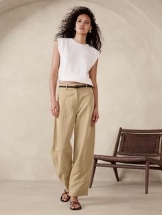 We took a fresh approach to the season's barrel-leg silhouette, achieving an architectural effect with special seams at the knee and hem to create that slightly bowed silhouette through the leg.  Here, we cut this pant in a beautifully breathable blend of TENCEL™ lyocell and luxurious linen--a fabric we love for its silky drape and its ability to stay fresh even in heat and humidity.  Barrel Leg: High rise (11") with a relaxed, barrel leg.  Ankle length Sustainability: Made with TENCEL™ lyocell, a sustainably sourced fiber from responsibly-harvested trees.  Zip fly with hook-and-bar closure.  Removable slider belt.  Front and back pockets.  Unlined.  Barrel Leg: High rise (11") with a relaxed, barrel leg.  Ankle length.  Inseams: Petite/Short 25. 5", Regular 27. 5", Tall 30. 5" Model: Size Medium Tv Show, Linen Pant, Technology Fashion, Petite Shorts, Celebrity Lifestyle, Europe Trip, Twill Pants, Stay Fresh, Linen Trousers