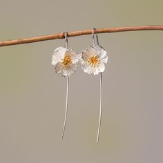 These Poppy Flower Drop Earrings, crafted from premium 925 silver, are an homage to the subtle power of nature's artistry. With petals that display a lifelike texture and a center delicately brushed with gold, they capture the wild and free essence of poppies in bloom. Lightweight and with a gentle sway, they offer a whisper of movement, a dash of sophistication to your daily wear or a statement piece for special occasions. Let these earrings be a symbol of resilience and beauty, mirroring the e Sterling Silver Flower Earrings For Mother's Day, Sterling Silver Flower Earrings For Anniversary And Mother's Day, Mother's Day Nickel-free Sterling Silver Flower Earrings, Delicate Sterling Silver Birth Flower Earrings, Elegant Sterling Silver Birth Flower Earrings, Mother's Day Silver Sterling Flower Earrings, Mother's Day Sterling Silver Flower Earrings, Delicate Sterling Silver Flower Earrings With Ear Wire, Handmade Silver Flower Earrings For Mother's Day