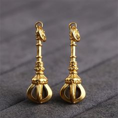 Gold Plated over Sterling Silver Vajra Dorje Charm, Meditation Bracelet, Tibetan Necklace, Buddhist Earring, Prayer Jewelry,Religious Charm material: Sterling silver size: 34*6mm, approx. 2.2g ♥ Related Product Links: * Bead caps:  https://www.etsy.com/shop/KozeyCrafts?ref=items-pagination&sort_order=date_desc&search_query=bead+caps * Clasp:   https://www.etsy.com/shop/KozeyCrafts?ref=items-pagination&sort_order=date_desc&search_query=clasp * Jump Ring:  https://www.etsy.com/shop/KozeyCrafts?ref=items-pagination&sort_order=date_desc&search_query=jump+ring * Rope:  https://www.etsy.com/shop/KozeyCrafts?ref=items-pagination&sort_order=date_desc&search_query=rope * Guru Bead:  https://www.etsy.com/shop/KozeyCrafts?ref=items-pagination&sort_order=date_desc&search_query=guru%2Bbead ♥ Transport: Silver Spiritual Brass Charm Necklace, Antique Gold Brass Spiritual Jewelry, Spiritual Silver Dangle Charms, Silver Spiritual Dangle Charms, Spiritual Brass Filigree Jewelry, Vajra Dorje, Tibetan Necklace, Meditation Bracelet, Religious Jewelry