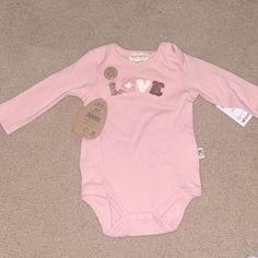 Brand New! Never Used! Still Has Tags 6-9 Month Pink Onesie Long Sleeve Says Love On It Smoke Free Home Cute Long Sleeve Onesie, Cute Long Sleeve Bodysuit For Playtime, Sweet Cotton Onesie For Playtime, Pink Long Sleeve Romper For First Birthday, Pink Onesie, Bear Pink, Love Baby, Pink Love, Onesies