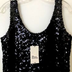 An Overall Sequins Finish Sleeveless Top That Will Shine All Day And Night. Scoop Neckline. Party Season Tank Top, Black Sequin Tank Top For Evening, Black Sleeveless Top For Party Season, Fitted Tank Top For Party Season, Black Tank Top For Night Out Party Season, Sleeveless Tank Top For Night Out And Party Season, Sleeveless Sequin Tank Top For Party Season, Sequin Sleeveless Tank Top For Party Season, Sequined Sleeveless Tank Top For Night Out