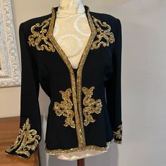 This Jacket Is Exquisite! Every Bead Meticulously Placed Masterfully Tailored! Sooo Gorgeous! Gold Sequins, Seed Beads & Round & Oval Gold Toned Beads. Small Shoulder Pads, Fully Lined. Has A Gold Bib That Can Be Removed From Snaps. Hidden Snap Closure. Excellent Condition. *Please See All Photos As Part Of Description.* Smoke Free Home. Elegant Fall Outerwear With Gold Embroidery, Elegant Embellished Festive Outerwear, Elegant Long Sleeve Outerwear With Gold Embroidery, Festive Embellished Evening Blazer, Festive Evening Embellished Blazer, Elegant Embellished Black Outerwear, Elegant Blazer With Gold Embroidery For Party, Elegant Black Embellished Outerwear, Elegant Embroidered Evening Outerwear