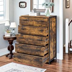 a wooden dresser sitting in the middle of a living room