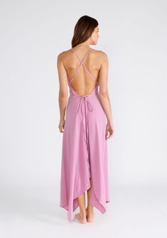 Freshen up your warm-weather wardrobe with our versatile halter neck beach dress in a breathable cotton gauze fabrication. This show-stopping style features a plunging v-neckline and a handkerchief hemline. The long straps can be tied in multiple ways, making it the most versatile dress in your closet. Airy cotton gauze Sleeveless Maxi length Handkerchief hemline V-neckline Halter neck Open back Cross back detail Long straps can be tied in multiple ways Model is 5'9, wearing a size S/M.Style: I-70552W-RJZ Summer Flowy V-neck Halter Dress, Flowy V-neck Halter Dress With Tie Back, Flowy V-neck Halter Dress For Beach, Chic Cotton Maxi Dress For Beach Cover-up, V-neck Beach Dress With Tie Back, Chic V-neck Backless Dress For The Beach, V-neck Tie Back Sundress, Backless V-neck Sundress With Tie Back, Summer Flowy Backless Midi Dress