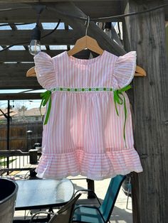 Vintage pink stripe flutter sleeve dress. Size- estimated 3t. please check measurements. Length- 18 in Width- 12 in ptp couple of tiny faint blue spots. see last photo. Striped Ruffle Dress For Playtime, Cute Butterfly Sleeve Beach Dress, Striped Spring Dresses For Playtime, Striped Summer Dress For Playtime, Playful Striped Short Sleeve Dress, Cute Striped Dress For Playtime, Striped Short Sleeve Dress With Ruffles, Striped Dress With Ruffle Sleeves For Spring, Flutter Dress