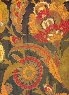 an old rug with flowers and leaves on it