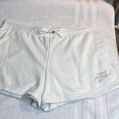 Nike Shorts. Nwot, Brand New, Never Worn. So Practical And Comfortable, You’ll Wear Them All Summer, Perfect For Your Next Vacation! Elastic Drawstring Waistband With Two Side Pockets And Nike Swoosh Logo On Left Side. 80% Cotton/20% Polyester. Machine Washable. Smoke Free Home. Casual White Drawstring Bottoms, Nike Spring Bottoms With Drawstring, Casual White Bottoms With Drawstring, Comfortable White Nike Bottoms, Nike Cotton Bottoms With Drawstring, Nike White Leisure Bottoms, White Leisure Shorts, Casual White Shorts For Leisure, Comfortable White Shorts For Spring