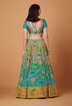 Editor's Note Aqua Turquoise Ombre Hand Embroidered Lehenga Set With SB Signature Wild Flower Print, Sunkissed Yellow Suede Velvet Embroidered Border and Silk Organza Embroidered Scallop Dupatta. Fabric: Dupion, Pure Crepe, Silk Organza, Suede Velvet Color: Aqua Turquoise Care: Dry Clean Only Disclaimer: Product Color May Slightly Vary Due To Photographic Lighting Sources Or Your Monitor Setting. About the Designer Siddhartha Bansal, label epitomise its design philosophy touring around " Golden Turquoise Ombre, Embroidered Lehenga, Lehenga Blouse, Ombre Effect, Aqua Turquoise, Velvet Color, Designer Dresses Indian, Silk Organza, Bridal Lehenga