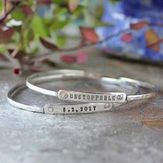 The large silver hammered cuff us currently out of stock!!--> We love the symbolism behind our inspirational bracelets, stamped with words of encouragement!  These designs are meant to remind you that you are Unstoppable, have SISU or you love EAP!  On these bangle bracelets we can stamp the words, dates, milestones or phrases that encourage you! Mix metal combinations and styles to create a personalized set of bracelets that is meaningful to you!  The above price Silver Stackable Bracelets For Friendship, Silver Stackable Friendship Bracelets, Adjustable Bangle Bracelet For Promise, Inspirational Sterling Silver Nickel-free Bracelets, Everyday Spiritual Engraved Bracelets, Adjustable Stackable Bangle For Everyday, Minimalist Hand Stamped Name Bracelet For Friendship, Stackable Bangle Bracelets For Friendship, Adjustable Stamped Sterling Silver Bracelets