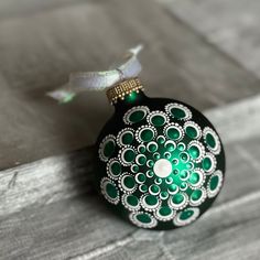 a green ornament sitting on top of a table