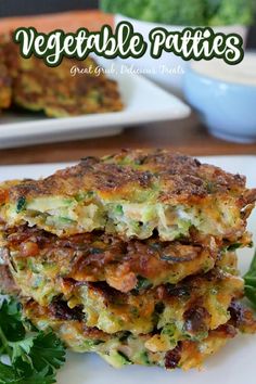 vegetable patties are stacked on top of each other with parsley in the background