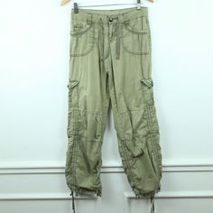 Vintage 90s/Y2K Unionbay cargo pants size 3. They are 100% cotton. They are a lightweight woven fabric for spring/summer. missing buttons on back pockets, holes on pockets where heavy buttons are attached, see photos. There are no stains. Please see all photos for condition and check the measurements for size. Waist 30" Hip 38" Rise 8 3/4" Inseam 31" Leg Opening 18" AA Y2k Wide Leg Green Cargo Pants, Y2k Green Wide Leg Cargo Pants, Mid-rise Cotton Parachute Pants With Pockets, Green Baggy Y2k Cargo Pants, Green Y2k Style Baggy Cargo Pants, Y2k Style Green Cotton Bottoms, Green Y2k Style Cotton Bottoms, Y2k Green Bottoms With Cargo Pockets, Y2k Green Cargo Bottoms