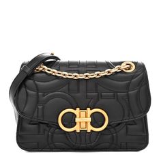 This an authentic SALVATORE FERRAGAMO Calfskin Quilted Gancini Flap Bag in Black. This chic day to evening bag is crafted of luxurious textured quilted leather in black. The shoulder bag features an adjustable cross body shoulder strap with aged gold clasps. The front flap opens to a black leather interior with a front pocket and zipper pocket. Luxury Quilted Flap Bag, High-end Quilted Shoulder Bag For Formal Occasions, Designer Textured Leather Flap Bag For Formal Occasions, Designer Textured Leather Flap Bag For Formal Events, Quilted Rectangular Flap Bag For Evening, Luxury Textured Leather Flap Bag, Elegant Quilted Business Shoulder Bag, Elegant Quilted Business Bag, Quilted Leather Evening Bag