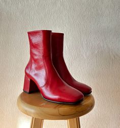 Handmade Red Napa Leather Boots for Women | Stylish Women's Red Boots | Custom Red Leather Booties | Trendy Women's Footwear Key Features: * Handmade Craftsmanship: Each pair is carefully made by skilled artisans, offering a unique and timeless look. * Napa Red Leather: Soft, durable, and long-lasting, the red leather adds both style and comfort. * Versatile Design: Perfect for both casual and dressy outfits, these boots easily go from day to night. * Durable Quality: Built with high-quality italian napa leather for long-lasting wear through many seasons. Ideal for: *  Everyday Wear: Pair with jeans or leggings for a chic, standout look. * Perfect for Dresses and Skirts: Perfect for adding a sophisticated touch to your favorite dresses and skirts. * Whether you're exploring the city or dre Red Heeled Boots With Reinforced Heel For Winter, Winter Red Heeled Boots With Reinforced Heel, Womens Red Boots, Trendy Red Boots With Square Toe, Red Ankle Heeled Boots, Red Medium Width Heeled Boots For Fall, Trendy Red Square Toe Boots, Trendy Red Boots Medium Width, Red Leather Boots Standard Fit