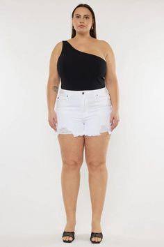 Cleo High Rise Shorts (Plus Size) by Kancan | The Ultimate Denim Shop | Premium denim meets comfort | Designed in Los Angeles. Our Cleo High Rise Shorts is perfect for Summer. Get comfortable in our stretch white color denim that accentuates your curves and is great for everyday wear. Features a fun frayed hem, a single button, optic white color, and distress! Shop now! trendy plus size shorts, high waisted plus size shorts, stylish plus size shorts, plus size casual wear, summer fashion Stretch Mid-rise White Jean Shorts, White Stretch Mid-rise Jean Shorts, Casual White Bottoms With Frayed Hem, White Stretch Cutoff Jean Shorts, White Bottoms With Frayed Hem For Summer, White Mid-rise Bottoms With Frayed Hem, White Stretch Mid-rise Shorts, High Waist White Bottoms With Frayed Hem, White High-waist Bottoms With Frayed Hem