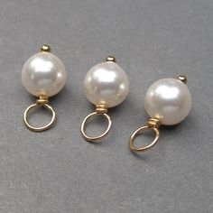 These dangles were created using approx. 6mm White Swarovski pearls. Each pearl has been wire wrapped on a 14k gold fill ball end headpin. Pearl is the birthstone charm for June. This listing is for 3 dangles. MORE PEARLS: https://www.etsy.com/shop/TheDangleDiva?ref=hdr_shop_menu§ion_id=7328420 MORE Dangles and Pendants: http://www.thedanglediva.etsy.com FOLLOW me: www.facebook.com/thedanglediva for new designs and discount coupons INTERCHANGEABLE EARRINGS: https://www.etsy.com/shop/TheDangleDiv Pearl Bangle Bracelet, Charms Collection, Interchangeable Earrings, Pearl Birthstone, Rose Gold Pearl, Necklace Charms, Charms Necklace, White Pearl Earring, Pearl Bangle