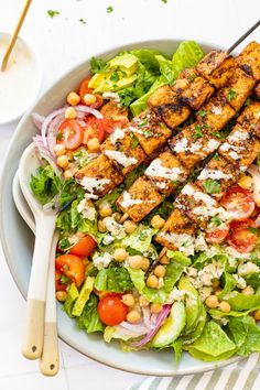 a salad with grilled tofu and chickpeas