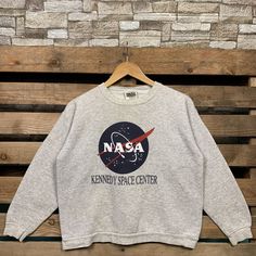 Vintage 90s Nasa Kenedy Space Center Sweatshirt Nasa Pullover Sweater Nasa Crewneck Jumper Nasa Kenedy Space Center Logo Graphic Print Grey Brand Name :- Tultex  📌 Tag Size :-  XLarge Youth  📌 Recommend Size :- Small Manual Measurement :- WIDTH (armpit to armpit) :- 20 inches / 51cm LENGTH (shoulder to end of garment) :- 21 inches / 53cm Condition :- Good Condition 7/10. Minor Defect Stain Refer Picture. 📮FED EX / DHL EXPRESS = 3-6 business day arrived Vintage Sweater With Letter Print And Long Sleeves, Vintage Long Sleeve Sweater With Letter Print, 90s Long Sleeve Sweater With Letter Print, Retro Crew Neck Sweatshirt For Winter, 90s Crew Neck Top For Winter, Vintage Letter Print Winter Sweater, Vintage Letter Print Sweater For Winter, 90s Crew Neck Winter Tops, Vintage Relaxed Fit Letter Print Sweater