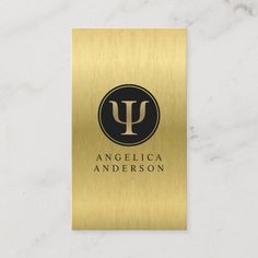 gold and black business card with the letter u