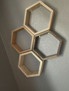 three wooden hexagonals hanging on the wall