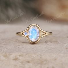 Unique Oval Moonstone Engagement Ring Vintage Solid Gold Moonstone Ring Round Moonstone Ring Vintage Women Wedding Anniversary Promise ring ITEM DETAILS ●Available in yellow, white or rose solid 10k, 14k or 18k gold. This ring can be made in Platinum. ❀❀Center Stone: Moonstone Shape: Oval shape Size: 6x8mm Side Stone: Moonstone Shape: Round shape Band width about 1.5mm Visit my shop for more jewelry: https://www.etsy.com/shop/TheRoseCastle if you would like to customize your unique ring, you may contact us about your ideas and pictures. Hope I could get the chance to create fabulous rings for you! ❀Production ---- This ring is handmade and very good quality! Please allow 2-4 weeks for production. It can be made to any ring size.  ❀Engraving service We accept the engraving order, leave a no Victorian Moonstone Ring, Luxury Vintage Moonstone Oval Cabochon Ring, Moonstone Ring Vintage, Gold Moonstone Ring, Dream Future, Moonstone Engagement, Engagement Ring Vintage, Moonstone Engagement Ring, Full Eternity Ring