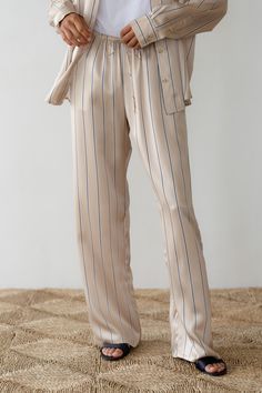 The Silk Pinstripe Pant is crafted from our luxe 100% Silk fabric. Featuring a drawstring waist, side pockets, straight-leg, and relaxed fit. Made in Los Angeles Chic Loungewear Pants With Vertical Stripes, Chic Striped Pants For Loungewear, Chic Vertical Stripes Loungewear Bottoms, Vertical Stripes Trousers For Loungewear, Straight Leg Vertical Stripes Loungewear Pants, Straight Leg Pants With Vertical Stripes For Loungewear, Straight Leg Vertical Stripes Pants For Loungewear, Los Angeles Shopping, Pinstripe Pants