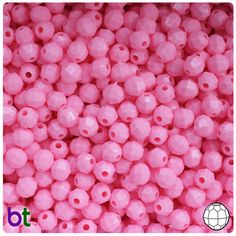 pink plastic beads with holes in the middle