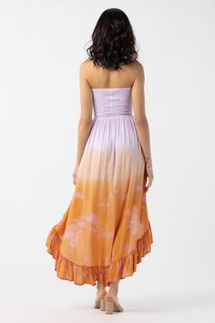 Embrace every moment in carefree style with lace up strings that can be tied in the front for a classic strapless fit or used to create a halter look. Featuring soft-fit comfort and draping fabric, the Aila Maxi Dress is a customizable piece designed to captivate. Details: 100% Rayon Hand wash cold & Lay flat to dry Features: Lace up sweetheart bodice, Can be worn strapless or halter, Ruffled high-low hemline Measures: Length from the top of the bodice to the shortest part of the hemline: approx Fitted Smocked Back Tube Top For Beach, Fitted Maxi Dress With Lace-up Back For Vacation, Spring Vacation Ruched Tube Top, Spring Strapless Tube Top With Ruched Bodice, Fitted Strapless Maxi Dress With Tie Back, Ruched Strapless Sundress For Summer, Spring Strapless Bandeau Dress With Smocked Back, Spring Bandeau Strapless Dress With Smocked Back, Strapless Ruched Bodice Tube Top For Summer