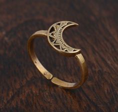 "Crescent Moon Ring, Gold Moon Ring, Stacking Ring, Dainty Ring, Minimalist Ring, Moon Ring, Dainty Ring, Half Moon Ring, Boho Ring ♥DETAILS♥ *Materials: Brass *Size: All sizes are available. ♥ BRASS SPECIALTY ♥ Brass is known for its strength and durability. However, it is also very malleable, making it ideal for shaping into intricate jewelry designs. Brass does not rust and is resistant to corrosion. However, it does develop a patina, or greenish layer, over time. ❥ Add this beautiful one little thing of galactic shine to make you feel unique and to transform your lives. Perfect for any kind of outfit and every occasion. ❥ Customers satisfaction is our biggest priority, please contact us with any questions/queries for future or existing orders, and we will do our best to make sure you a Bohemian Rings With Moon Charm For Gift, Adjustable Moon Shaped Bohemian Rings, Bohemian Crescent Rings For Gifts, Bohemian Moon Shaped Promise Ring, Bohemian Moon Shaped Adjustable Rings, Bohemian Moon Shape Promise Ring, Bohemian Adjustable Moon-shaped Rings, Bohemian Brass Stackable Rings, Bohemian Adjustable Rings With Moon Charm