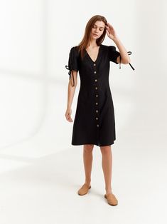 "MONICA is a knee length linen button down dress. DETAILS - Center front buttons - V neck - Knee length - Fitted bodice - No pockets - Oeko-Tex certified 100% lightweight linen - Cut and sewn to order just for you in our studio COLOR - Black, you can also choose other colors above - Fabric samples are available here https://www.etsy.com/listing/586569696/linen-fabric-samples SIZING & FIT - Fits true to size - Length (shoulder to hem) is approximately 39 inches / 99 cm - Bust approximately 33 Chic Fitted Knee-length Linen Dress, Chic Linen Button-up Dress, Fitted V-neck Linen Dress With Buttons, Chic Short Sleeve Linen Dress With Buttons, Short Sleeve Linen Dress With Buttons For Day Out, Chic Linen Day Dress With Buttons, Chic Daywear Linen Dress With Buttons, Chic Linen Dress With Buttons For Daywear, Chic Linen Dress With Button Closure For Day Out