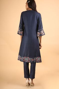 Editor's Note This set features a deep blue kurta handcrafted in silk featuring flared sleeves accentuated with hand embroidery on the sleeves and bottom. Neck: High Round Neck Sleeve Type: 3/4 Sleeve Fabric: Silk Care: Dry Clean Only Customize Your OutfitCan't find the size you're looking for? No stress. Just select the size "Custom" while adding the item to your cart. We will follow up with you for your body measurements. To request a color or design customizations, please contact our customer Traditional Festive Pant Set With Set-in Sleeves, Festive Fitted Sets With 3/4 Sleeve, Traditional Spring Kurta With Set-in Sleeves, Festive Kurta With Set-in Sleeves, Traditional Silk Kurta With Set-in Sleeves, Traditional Festive Dresses With Set-in Sleeves, Bohemian Straight Kurta With Embroidered Sleeves, Cotton Anarkali Sets With Embroidered Sleeves, Festive Straight Kurta With Set-in Sleeves