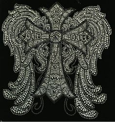 an intricately designed black and white design with silver beads on the back of it