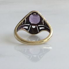 Details: Victorian 14K gold Art Deco amethyst ring circa 1930's. Beautiful deco design, with leaf inspired pattern. The lovely amethyst measures 6.7mm x 6.7mm, and sits about 5.5mm from the finger. The setting measures 15.4mm from top to bottom. The ring is in excellent condition. Please ask all necessary questions prior to placing an order. Measurements: The size is 7 US and can be sized for a fee. Condition: The overall all condition of this ring is excellent condition and the stone is securel Purple Rose Cut Diamond Rings In 14k Gold, Purple 14k Gold Ring With Rose Cut Diamonds, Purple 14k Gold Rings With Rose Cut Diamonds, Heirloom Style Purple Amethyst Ring With Bezel Setting, Heirloom Purple Amethyst Ring With Bezel Setting, Purple Amethyst Art Deco Ring, Antique 14k Gold Amethyst Ring, Classic Purple Gemstone Signet Ring, Elegant Amethyst Hallmarked Signet Ring