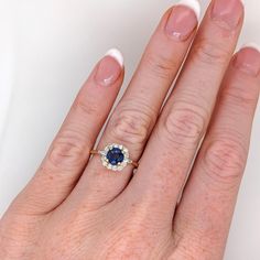 This beautiful ring features a 0.81 carat square emerald cut Blue Sapphire gemstone with a halo of natural earth mined diamonds set in solid 14K gold. This Blue Sapphire ring makes a lovely September birthstone gift for your loved ones! This ring is made with solid 14K Gold and natural Earth mined SI / G-H diamonds. As listed, this ring is ready to ship. If you're interested in purchasing this setting with a different center stone please message us! 14k Gold Emerald-cut Halo Cluster Ring, 14k Gold Emerald-cut Cluster Ring With Halo Design, 14k Gold Emerald Cut Cluster Ring With Halo Design, 14k Gold Emerald Cut Halo Cluster Ring, 14k Gold Emerald Cut Sapphire Ring With Halo Setting, 14k Gold Sapphire Ring With Halo Design For Promise, 14k Gold Sapphire Halo Ring, 14k Gold Sapphire Ring With Halo Design, Emerald Cut Diamond Birthstone Ring With Halo Setting