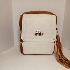 Steve Madden Backpack Cream & Brown Monogram Straps Walk With Style 11.5x10.25x4 White Rectangular Leather Backpack For Daily Use, White Rectangular Leather Backpack For School, Cream Rectangular Backpack For Daily Use, White Leather Backpack With Zipper Closure, White Leather Rectangular Backpack For Everyday Use, Trendy White Rectangular Leather Backpack, Trendy Cream Rectangular Backpack, Cream Rectangular Backpack For Everyday Use, Rectangular Cream Backpack For Everyday Use