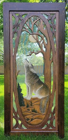 a wooden frame with an image of a wolf in the woods on it's side