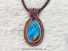 "Sleek Labradorite Pendant Necklace created with Wire Wrapping. Copper Crystal Wire Wrapped Pendant, Protection Necklace Witchy Jewelry Unique Handmade Artisan Jewelry !! Original Designs by ArtsvilleHandcrafted The pendant is made from pure copper wires and Labradorite stone combination.. Wear this necklace for the healing properties of this amazing stone. Select Necklace Length of your choice !! All Jewelry is nicely packed and dispatched within 1-2 working Days. I love to create beautiful uni Handmade Labradorite Round Pendant Jewelry, Handmade Oval Labradorite Jewelry, Handmade Labradorite Oval Pendant Jewelry, Handmade Artisan Labradorite Jewelry, Handmade Labradorite Oval Pendant Necklace, Handmade Oval Artisan Jewelry, Artisan Handmade Labradorite Necklaces, Handmade Oval Labradorite Necklace, Handmade Oval Nature-inspired Jewelry