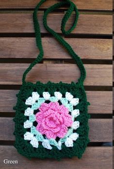 "Beautifully hand crafted purse design with colorful floral patten. 100% Acrylic with 100% Eco-fi lining (Polyester fiber made from 100% post-consumer recycle plastic bottles). Size: 6\" W x 6\" H Strap: 40\" *Hand-wash Recommended, All sizes are approximate." Green Flower-shaped Bag For Spring, Green Flower Shaped Shoulder Bag For Summer, Green Flower-shaped Shoulder Bag For Summer, Green Floral Shoulder Bag For Summer, Summer Flower-shaped Green Shoulder Bag, Green Square Crochet Bag For Gift, Green Square Crochet Bag As Gift, Green Floral Shoulder Bag For Everyday Use, Green Crochet Bag For Spring