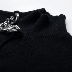 Stay warm and stylish this season with our Casual Hollow Chest Knitted Sweater. Crafted with comfort in mind, this sweater features a unique hollow chest design that adds a touch of elegance to any outfit. - Color: Black- Style: Sweater- Pattern Type: Solid- Sleeve Length: Long Sleeve- Neckline: Turtleneck- Fabric: Wool Blend- Closure Type: Pullover- Details: Chains- Fit Type: Loose- Occasion: Casual- Gender: Women- Size: S, M, L Unit：cm Size Length Bust Shoulder Sleeve S 58 108 54 55.5 M 60 112 Black Cropped Sweater For Winter Layering, Chic Chunky Knit Sweater Vest For Winter, Chic Soft Knit Sweater Vest For Winter, Elegant Fall Sweater, Elegant Acrylic Sweater For Fall, Black Turtleneck Sweater Vest For Fall, Trendy Black Knit Sweater, Elegant Knitted Winter Sweater, Chic Black Sweater Vest For Winter