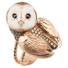 The owl ring, a mesmerizing accessory that captivates the hearts of those who behold it.The body of the owl ring is covered with brown stones that are black rhodium plated, and its wings have a florentine texture . But it doesn't stop there. The wings of the owl, meticulously crafted, possess the ability to move. A touch of whimsy is added to this already exquisite piece, as the wings gracefully flutter with the slightest movement, bringing the owl to life. It's as if the ring holds a secret, wh Fav Animal, Gold Owl, Owl Ring, Owl Jewelry, Black Rhodium, Delicate Details, Bird Feathers, Owls, Rhodium Plated