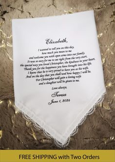 a white handkerchief with a poem written on it and gold foiling in the background