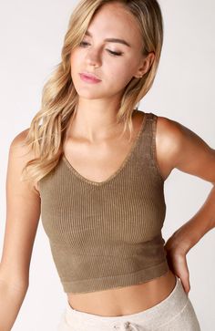 Comfy & Stylish! Pair with pretty much anything! Size: One Size Fits Most (XS-L) Description: Ribbed knit top featuring a v-neckline and cropped silhouette. Fabric: 92% Nylon / 8% Spandex Made in USA Does not have padding, wiring or cups. We believe in highlighting the natural shape of a woman's body. Chic Seamless V-neck Crop Top, Chic V-neck Seamless Crop Top, Trendy Seamless V-neck Crop Top, Trendy Knit V-neck Crop Top, Seamless V-neck Top For Summer, V-neck Stretch Crop Top With Built-in Bra, Seamless Stretch V-neck Crop Top, Seamless V-neck Crop Top For Summer, Seamless Fitted V-neck Crop Top