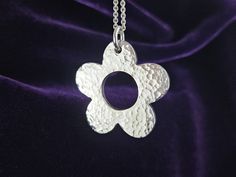 This beautiful simple flower design was hand carved by me in jewellers wax then was cast in solid sterling silver. This pendant was never moulded which makes this piece a one of a kind. The flower itself measures approximately 36mm in diameter and is lightly hammer textured on both sides. Flower-shaped Polished Jewelry Gift, Flower Shaped Polished Finish Jewelry As Gift, Flower Shaped Jewelry With Polished Finish For Gift, Flower Shaped Polished Finish Jewelry For Gift, Handmade Sterling Silver Flower Necklace, Handmade Silver Flower Necklace, Silver Flower-shaped Jewelry With Polished Finish, Silver Flower Jewelry With Polished Finish, Handmade Flower Pendant Necklace For Anniversary