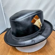 Need A Leather Fedora Hat That Can Travel Without Losing Its Shape, And That Looks Great With Any Outfit At Any Venue? This Nearly Impossible Combination Of Qualities Is Perfectly Embodied By The Soho Rocky Leather Packable Trilby. Featuring A Super Comfortable Removable Sweatband Liner That Attaches Securely With Velcro Tabs Sewn Into The Hat. Brim Measures 1 1/4" Crown Measures 3 1/4" Lightweight Usa Raised Cowhide Leather Unfinished | Natural All-Leather Trilby Style Fedora Water-Resistant And Offers Sun Protection Removable Sweatband Liner, Soft And Comfortable Made In The Usa This Listing Is For A Size Small. (Hat Size: 6 7/8 Or Head Measurement Of 21”-21 American Hat Makers, American Hat, Fedora Hat, Hat Sizes, Cowhide Leather, Soho, Sun Protection, Fedora, Black Leather