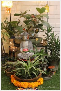 there is a buddha statue surrounded by plants